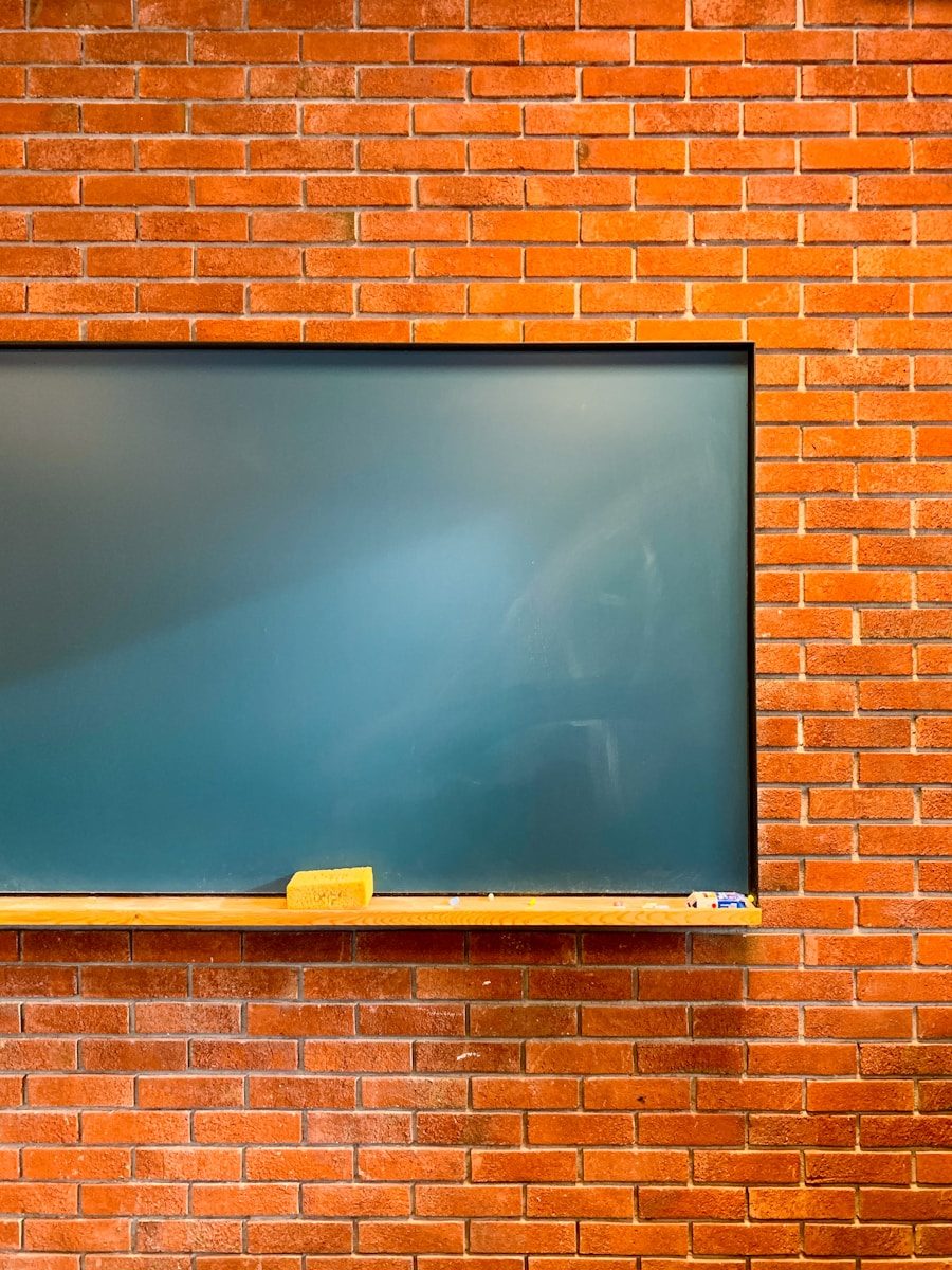 Photo by ESMA // 에스마 a blackboard mounted to a brick wall